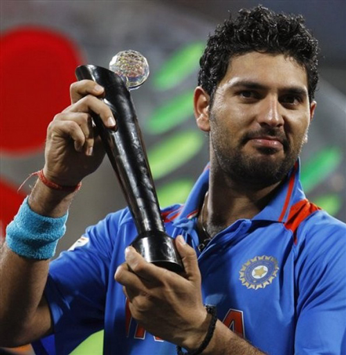 Yuvraj-Singh-with-the-ICC-World-Cup-2011-Player-of-the-Series-Trophy