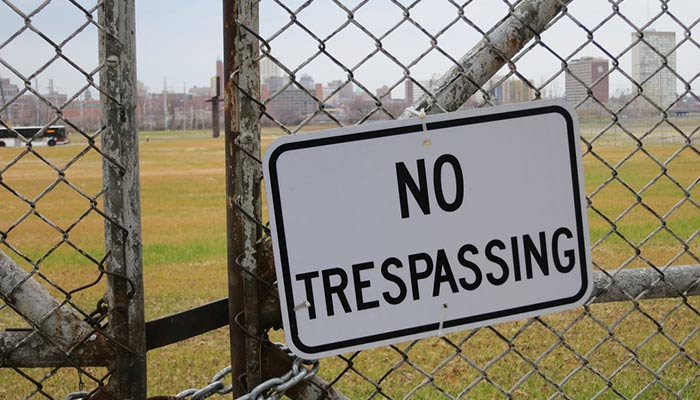 stop-crime-with-no-trespassing-sign
